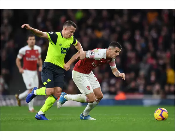Clash at Emirates: Xhaka vs Hogg in Arsenal's Battle Against Huddersfield