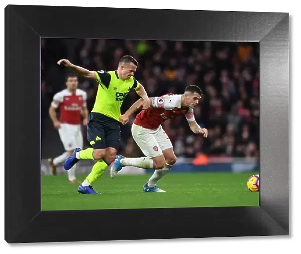 Clash at Emirates: Xhaka vs Hogg in Arsenal's Battle Against Huddersfield