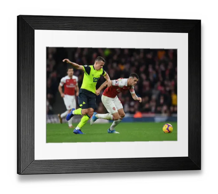 Framed Print : Clash at Emirates: Xhaka vs Hogg in Arsenal's Battle Against Huddersfield