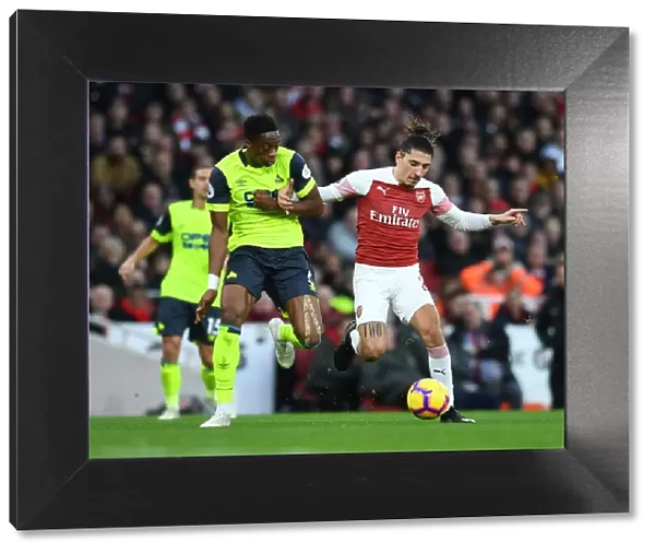 Arsenal's Bellerin Clashes with Huddersfield's Kongolo in Premier League Showdown