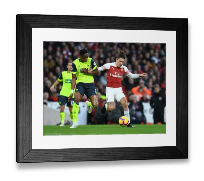 Framed Print : Arsenal's Bellerin Clashes with Huddersfield's Kongolo in Premier League Showdown