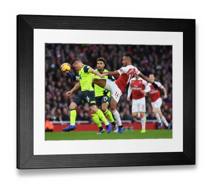 Framed Print : Arsenal's Aubameyang Clashes with Huddersfield's Hogg in Premier League Showdown Framed Print : Arsenal's Aubameyang Clashes with Huddersfield's Hogg in Premier League Showdown