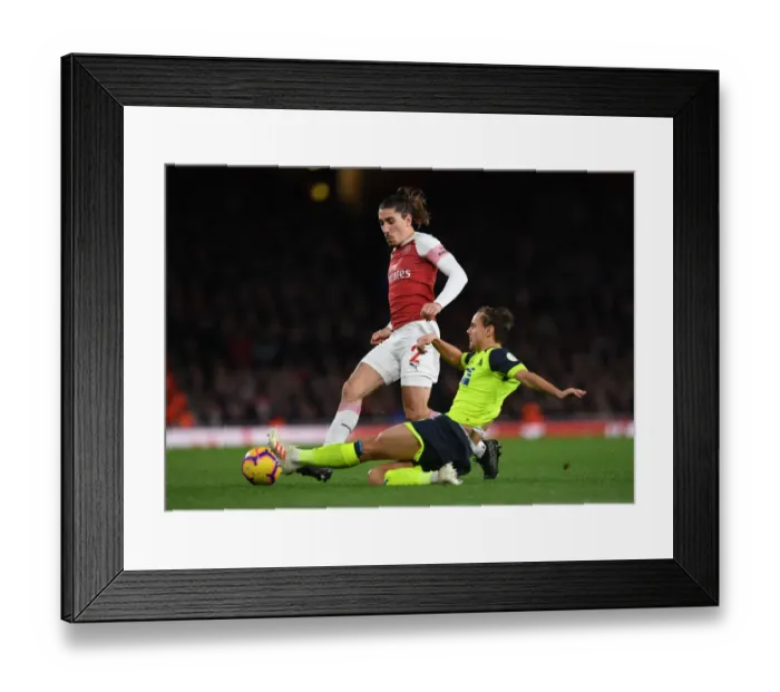 Framed Print : Arsenal's Bellerin Faces Off Against Huddersfield's Lowe in Premier League Clash Framed Print : Arsenal's Bellerin Faces Off Against Huddersfield's Lowe in Premier League Clash