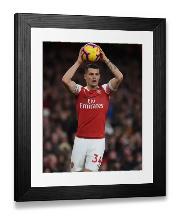 Framed Print : Granit Xhaka: Arsenal's Midfield Maestro in Action Against Huddersfield Town, Premier League 2018-19 Framed Print : Granit Xhaka: Arsenal's Midfield Maestro in Action Against Huddersfield Town, Premier League 2018-19