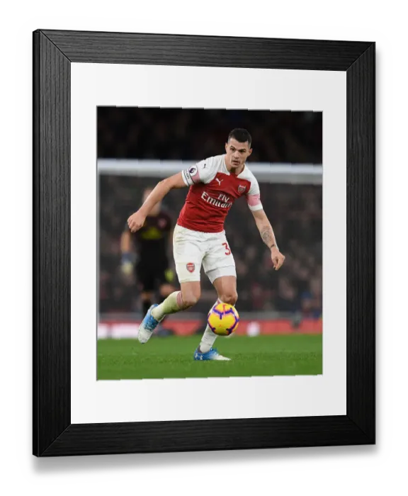 Framed Print : Granit Xhaka: Arsenal's Midfield Mastermind in Action against Huddersfield Town, Premier League 2018-19