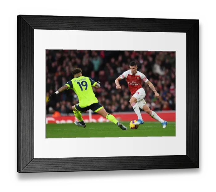 Framed Print : Xhaka vs Williams: Intense Battle at Emirates Stadium - Arsenal v Huddersfield Town (Premier League, 2018-19) Framed Print : Xhaka vs Williams: Intense Battle at Emirates Stadium - Arsenal v Huddersfield Town (Premier League, 2018-19)
