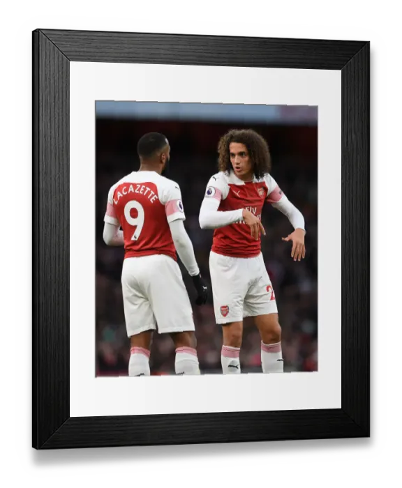 Framed Print : Arsenal's Guendouzi and Lacazette in Action against Huddersfield Town (2018-19) Framed Print : Arsenal's Guendouzi and Lacazette in Action against Huddersfield Town (2018-19)