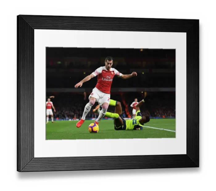 Framed Print : Arsenal's Mkhitaryan Clashes with Huddersfield's Kongolo in Premier League Showdown Framed Print : Arsenal's Mkhitaryan Clashes with Huddersfield's Kongolo in Premier League Showdown