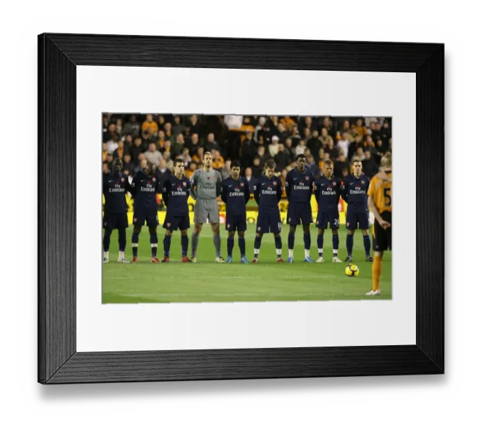 Framed Print : The Arsenal and Wolves teams observe a minutes silence