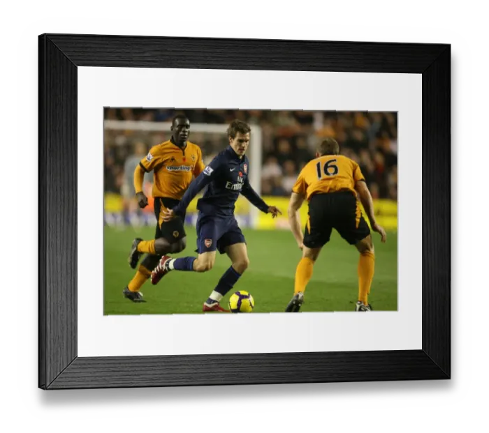 Framed Print : Aaron Ramsey (Arsenal) Christophe Berra (Wolves) Framed Print : Aaron Ramsey (Arsenal) Christophe Berra (Wolves)