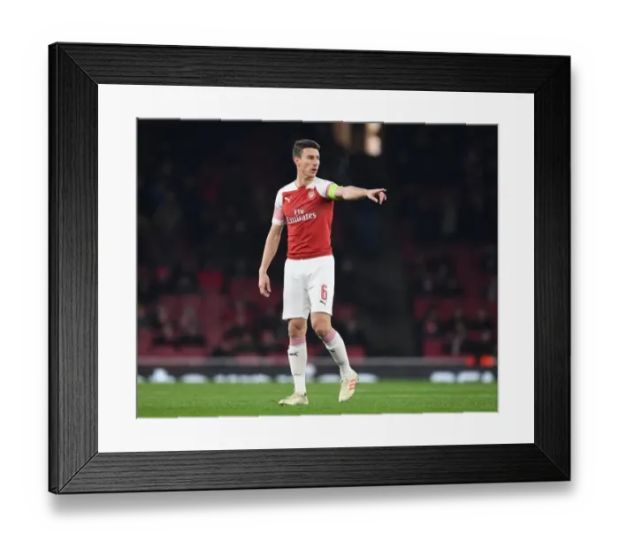 Framed Print : Arsenal's Laurent Koscielny in Action against Qarabag FK in UEFA Europa League Group E Framed Print : Arsenal's Laurent Koscielny in Action against Qarabag FK in UEFA Europa League Group E