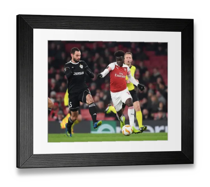 Framed Print : Arsenal's Saka Dashes Past Qarabag's Huseynov in Europa League Clash