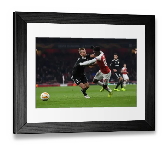 Framed Print : Bukayo Saka vs Maksin Medvedev: Arsenal vs Qarabag UEFA Europa League Clash Framed Print : Bukayo Saka vs Maksin Medvedev: Arsenal vs Qarabag UEFA Europa League Clash