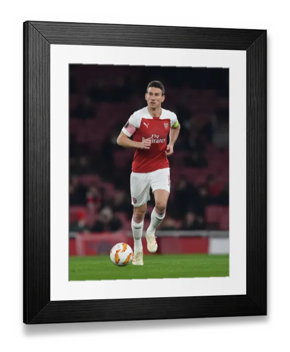 Framed Print : Arsenal's Laurent Koscielny in Action Against Qarabag in UEFA Europa League