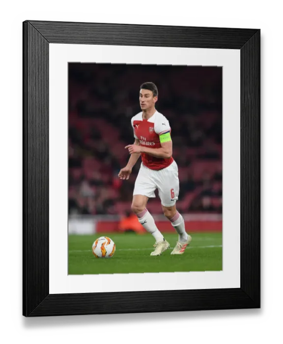 Framed Print : Focused Koscielny: Arsenal's Unyielding Defender in Europa League Battle Framed Print : Focused Koscielny: Arsenal's Unyielding Defender in Europa League Battle
