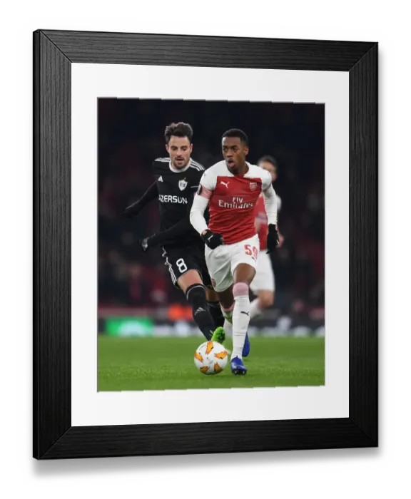 Framed Print : Arsenal's Joe Willock Clashes with Qarabag's Michel in Europa League Showdown