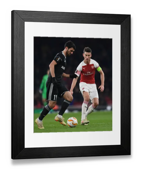 Framed Print : Arsenal's Koscielny Closes Down Qarabag's Madatov in Europa League Clash