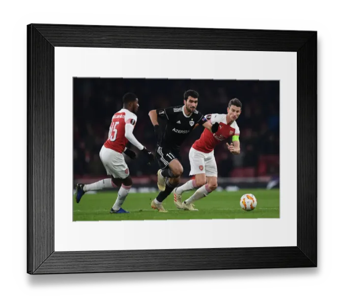 Framed Print : Arsenal's Koscielny Stifles Qarabag's Madatov in Europa League Clash
