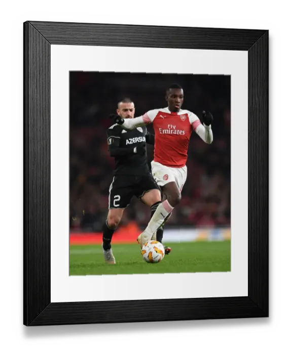 Framed Print : Arsenal's Eddie Nketiah Clashes with Qarabag's Gara Gareyev in Europa League Showdown