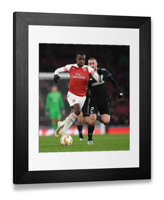 Framed Print : Arsenal's Eddie Nketiah Goes Head-to-Head with Qarabag's Gara Gareyev in Europa League Showdown Framed Print : Arsenal's Eddie Nketiah Goes Head-to-Head with Qarabag's Gara Gareyev in Europa League Showdown
