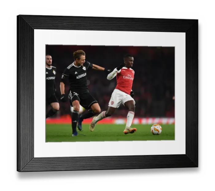 Framed Print : Arsenal's Eddie Nketiah Clashes with Qarabag's Jakub Rzezniczak in Europa League Showdown