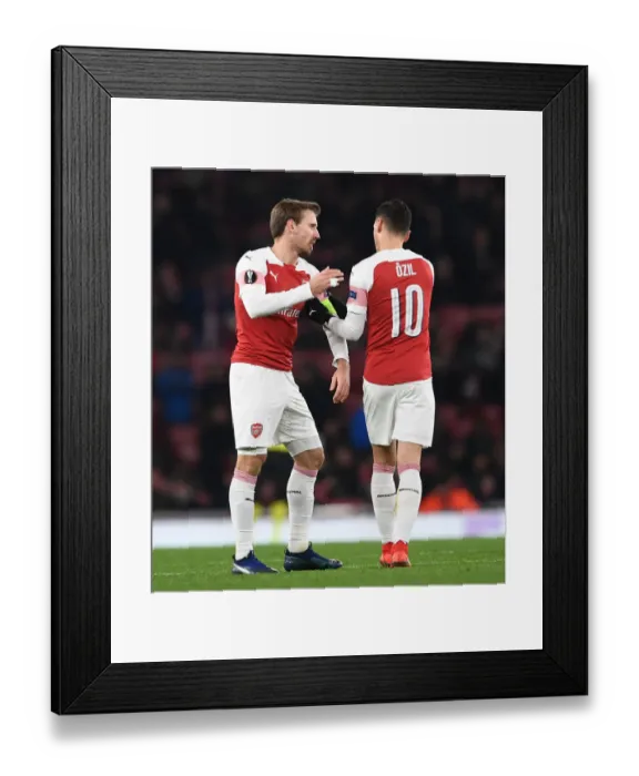 Framed Print : Arsenal: Ozil Passes the Captain's Armband to Monreal vs Qarabag, Europa League 2018-19