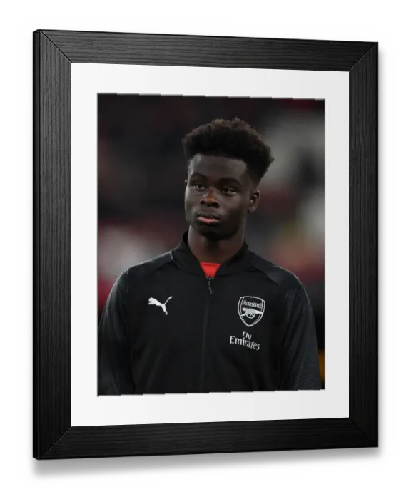 Framed Print : Bukayo Saka: Arsenal's Promising Talent Ahead of Qarabag Clash in Europa League Framed Print : Bukayo Saka: Arsenal's Promising Talent Ahead of Qarabag Clash in Europa League