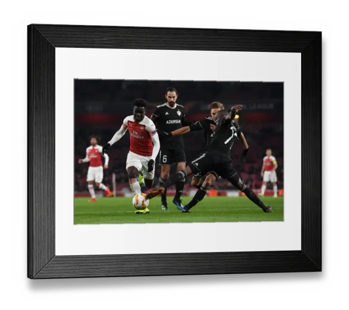 Framed Print : Bukayo Saka vs. Donald Guerrier: A Football Showdown at Emirates Stadium - Arsenal vs. Qarabag, UEFA Europa League
