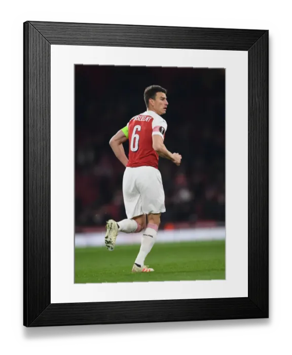 Framed Print : Focused Koscielny: Arsenal's Unyielding Defender in Europa League Battle Against Qarabag
