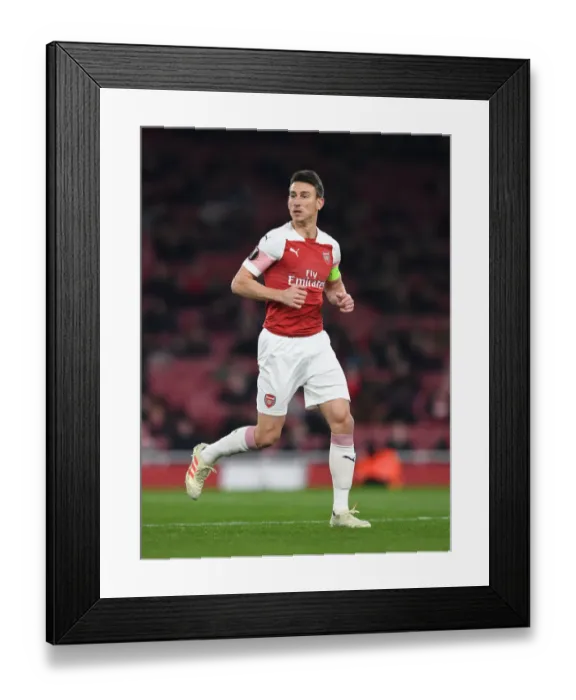 Framed Print : Laurent Koscielny Focuses in Arsenal's Europa League Clash Against Qarabag
