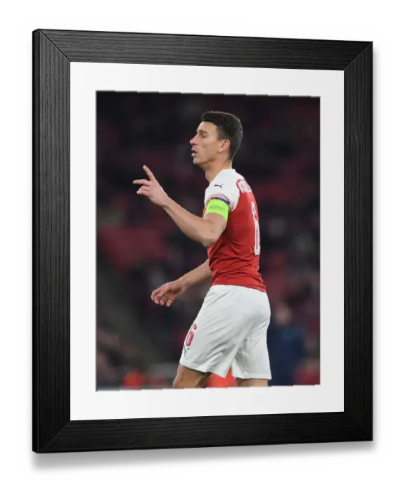 Framed Print : Focused Koscielny: Arsenal's Unyielding Defender in Europa League Battle