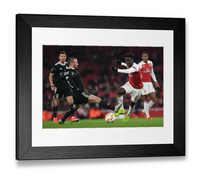 Framed Print : Clash of Wings: Bukayo Saka vs Gara Gareyev in Arsenal's Europa League Battle