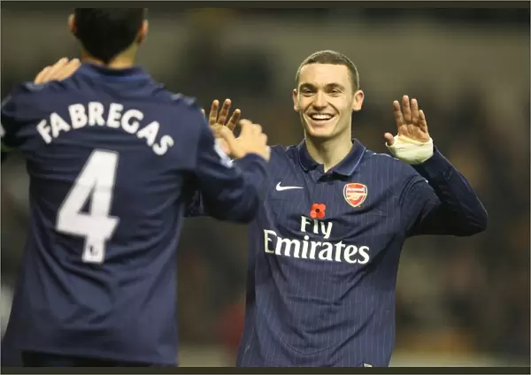 Thomas Vermaelen and Cesc Fabregas celebrate the 4th Arsenal goal