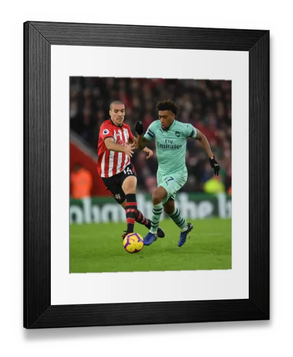 Framed Print : Clash at St. Mary's: Iwobi vs. Romeu in Southampton v Arsenal Football Showdown Framed Print : Clash at St. Mary's: Iwobi vs. Romeu in Southampton v Arsenal Football Showdown