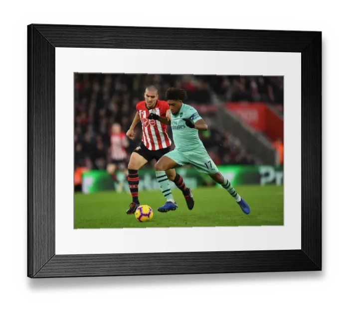 Framed Print : Clash of Midfield Titans: Iwobi vs. Romeu - A Premier League Showdown