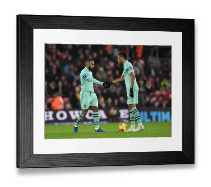 Framed Print : Lacazette and Aubameyang: United in Friendship and Rivalry - Arsenal's Striking Duo Shake Hands Before Second Half at Southampton (2018-19)