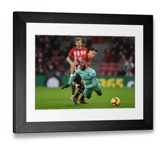 Framed Print : Clash at St. Mary's: Lacazette Fouls by Bednarek in Southampton vs Arsenal Premier League Encounter Framed Print : Clash at St. Mary's: Lacazette Fouls by Bednarek in Southampton vs Arsenal Premier League Encounter