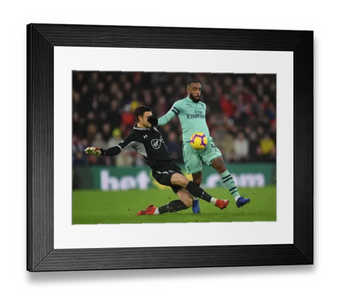 Framed Print : Arsenal's Lacazette Closes In on Southampton's McCarthy in Premier League Showdown