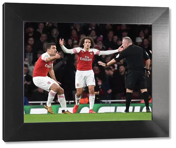 Arsenal's Sokratis and Guendouzi Protest Ref's Decision in Intense Arsenal vs. Tottenham Carabao Cup Clash