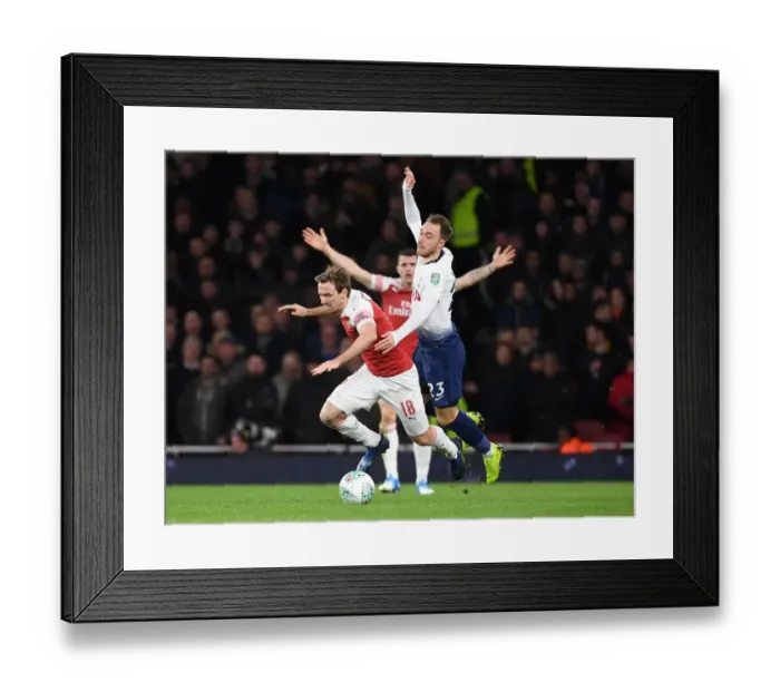 Framed Print : Monreal vs. Eriksen: A Carabao Cup Showdown at the Emirates Framed Print : Monreal vs. Eriksen: A Carabao Cup Showdown at the Emirates