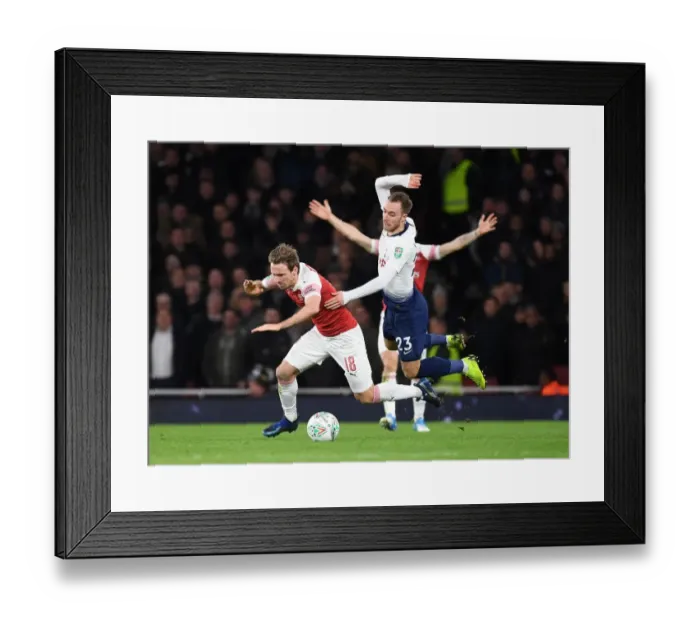 Framed Print : Monreal vs. Eriksen: A Carabao Cup Battle at the Emirates Framed Print : Monreal vs. Eriksen: A Carabao Cup Battle at the Emirates