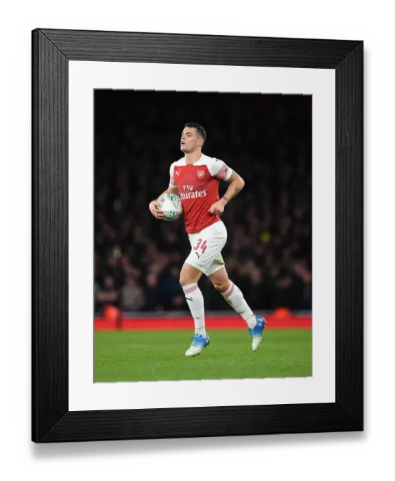 Framed Print : Xhaka's Midfield Battle: Arsenal vs. Tottenham in the Carabao Cup Quarterfinals