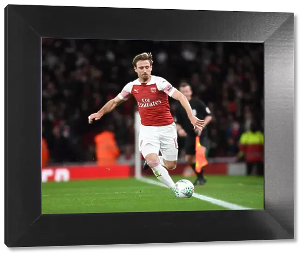 Monreal's Intense Concentration: Arsenal vs. Tottenham in Carabao Cup Quarterfinals