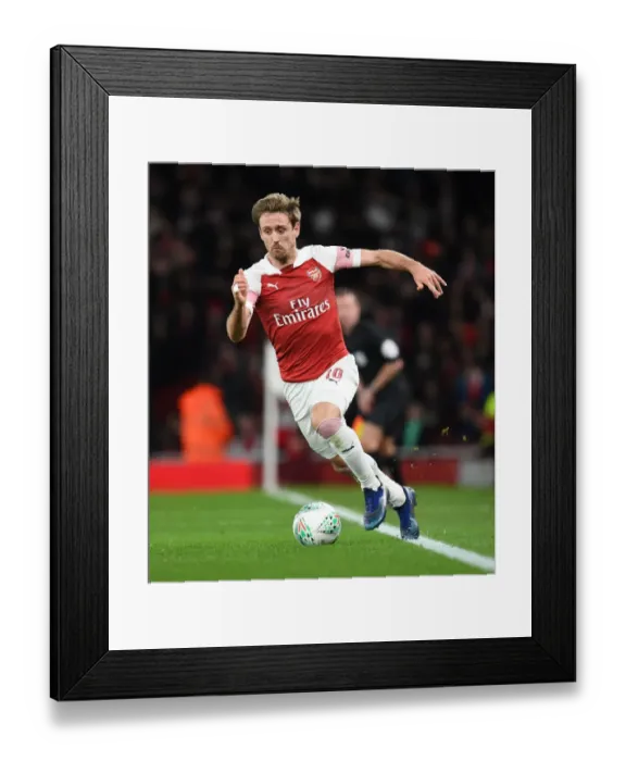 Framed Print : Monreal's Intense Focus: Arsenal vs. Tottenham in Carabao Cup Quarterfinals