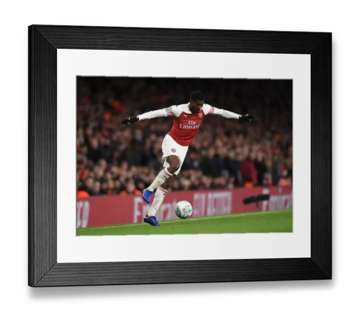 Framed Print : Ainsley Maitland-Niles Faces Off Against Tottenham in Carabao Cup Showdown