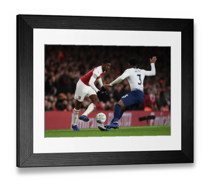 Framed Print : Arsenal's Ainsley Maitland-Niles Outmaneuvers Tottenham's Danny Rose in Carabao Cup Quarterfinal Showdown