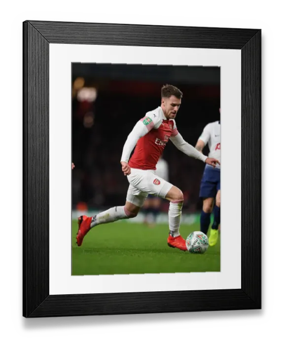 Framed Print : Arsenal's Aaron Ramsey in Action: Battle against Tottenham in Carabao Cup Framed Print : Arsenal's Aaron Ramsey in Action: Battle against Tottenham in Carabao Cup