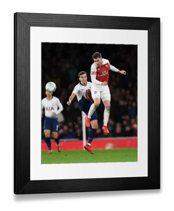 Framed Print : Arsenal's Aaron Ramsey Battles with Tottenham's Harry Winks in Carabao Cup Quarterfinal Showdown