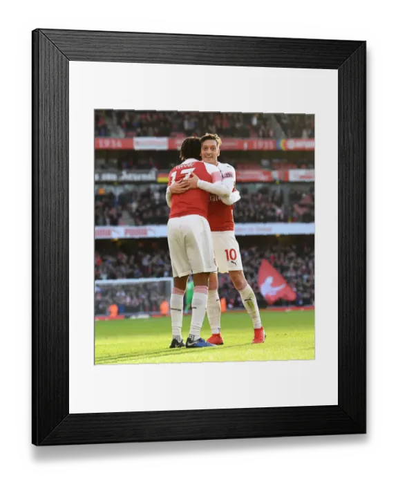 Framed Print : Celebrating Glory: Iwobi and Ozil's Triumphant Moment during Arsenal's Victory over Burnley