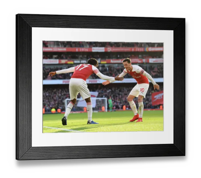 Framed Print : Triumphant Moment: Iwobi and Ozil's Euphoric Celebration after Iwobi's Goal for Arsenal against Burnley (2018-19)